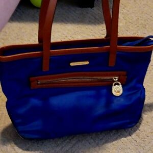 A blue Micheal horse pocket bag